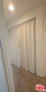 a spacious bedroom with a bed and a couch