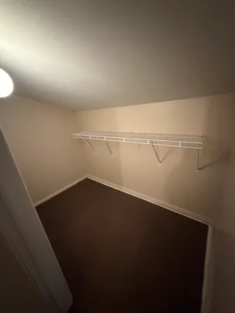 a view of a room with racks on the wall