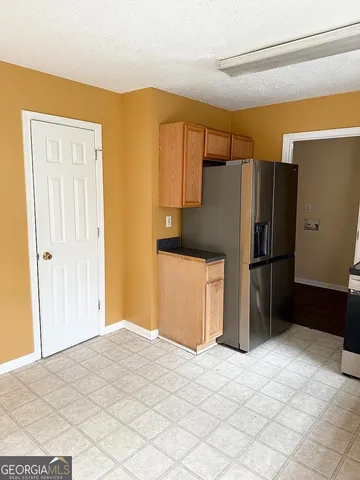 a bedroom with a bed and a cabinets