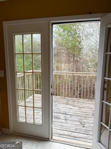 a view of wooden floor and a window