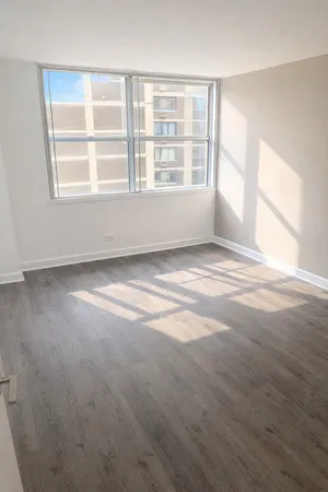 a view of an empty room with a window