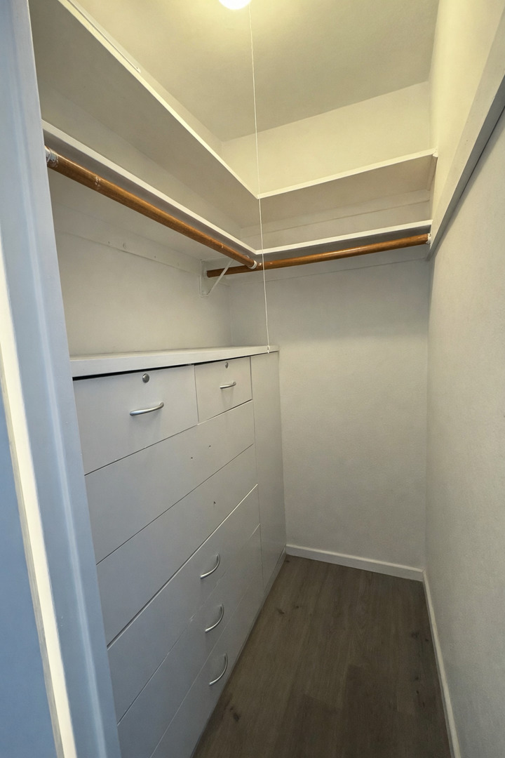 6301 North Sheridan Road, Unit 11C Chicago, IL 60660 - Photo 15 of 19 a view of a room with racks on the wall