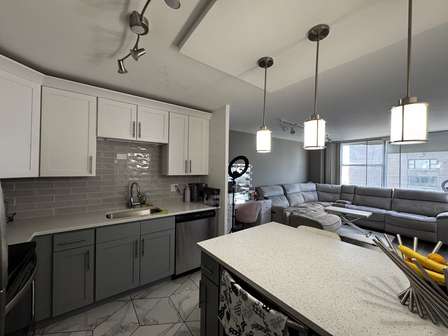 6301 North Sheridan Road, Unit 11C Chicago, IL 60660 - Photo 8 of 19 a kitchen with a sink a counter space appliances and cabinets