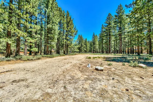 a view of street with parked cars