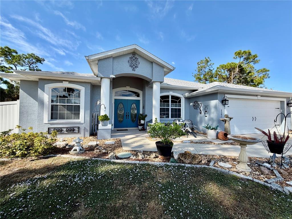2361 Baltimore Street North Port, FL 34286 - Photo 1 of 40 a front view of a house with sitting area