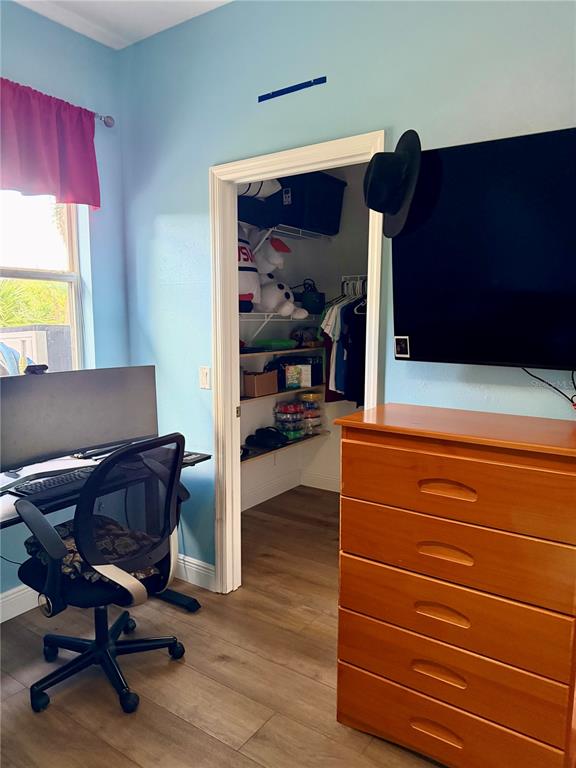 2361 Baltimore Street North Port, FL 34286 - Photo 24 of 40 a living room with furniture and a mirror