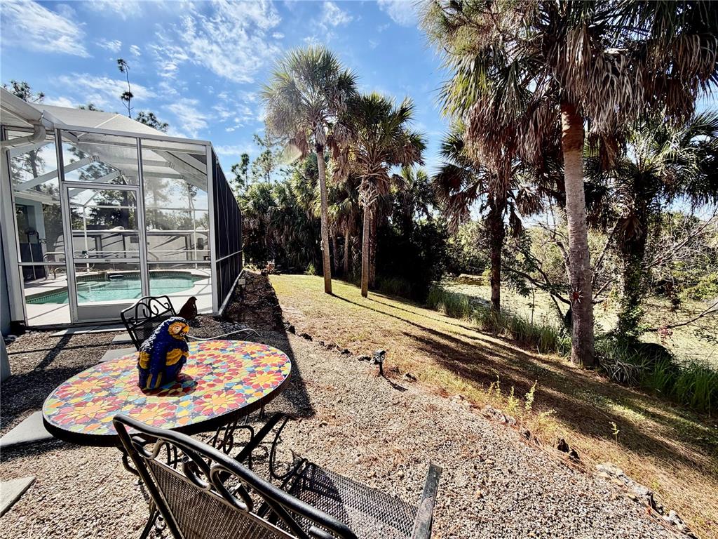 2361 Baltimore Street North Port, FL 34286 - Photo 35 of 40 a view of a chair and tables in the balcony