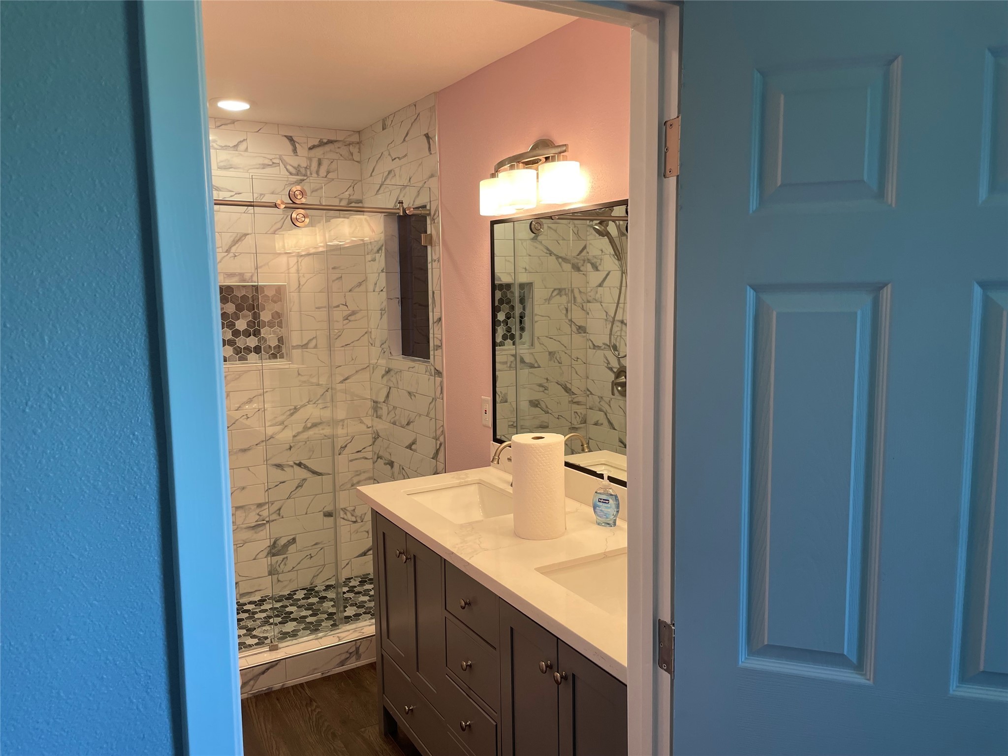 2709 Terry Street Houston, TX 77009 - Photo 15 of 23 a bathroom with a granite countertop sink a mirror and a shower