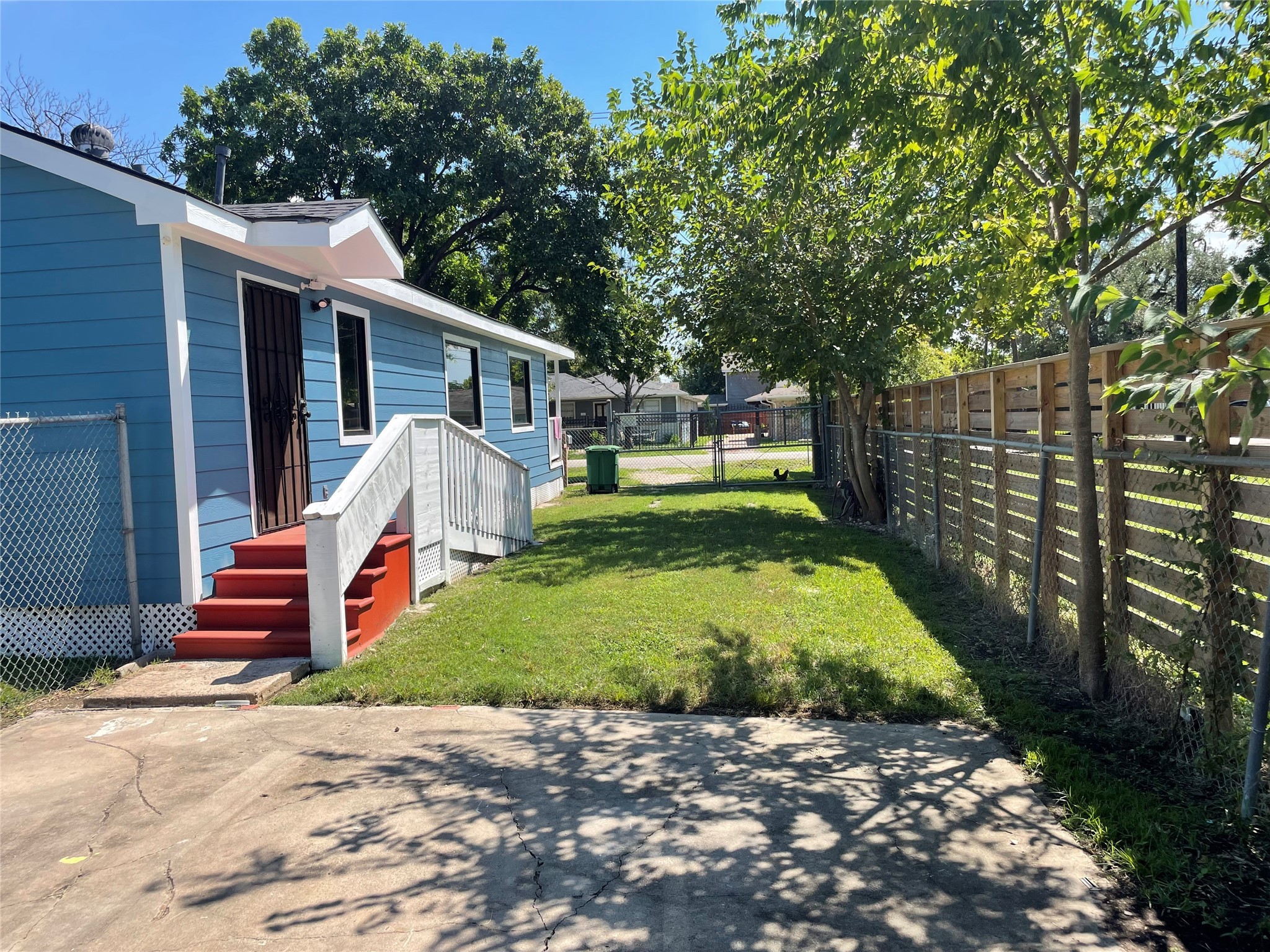 2709 Terry Street Houston, TX 77009 - Photo 4 of 23 a view of a house with backyard and trees