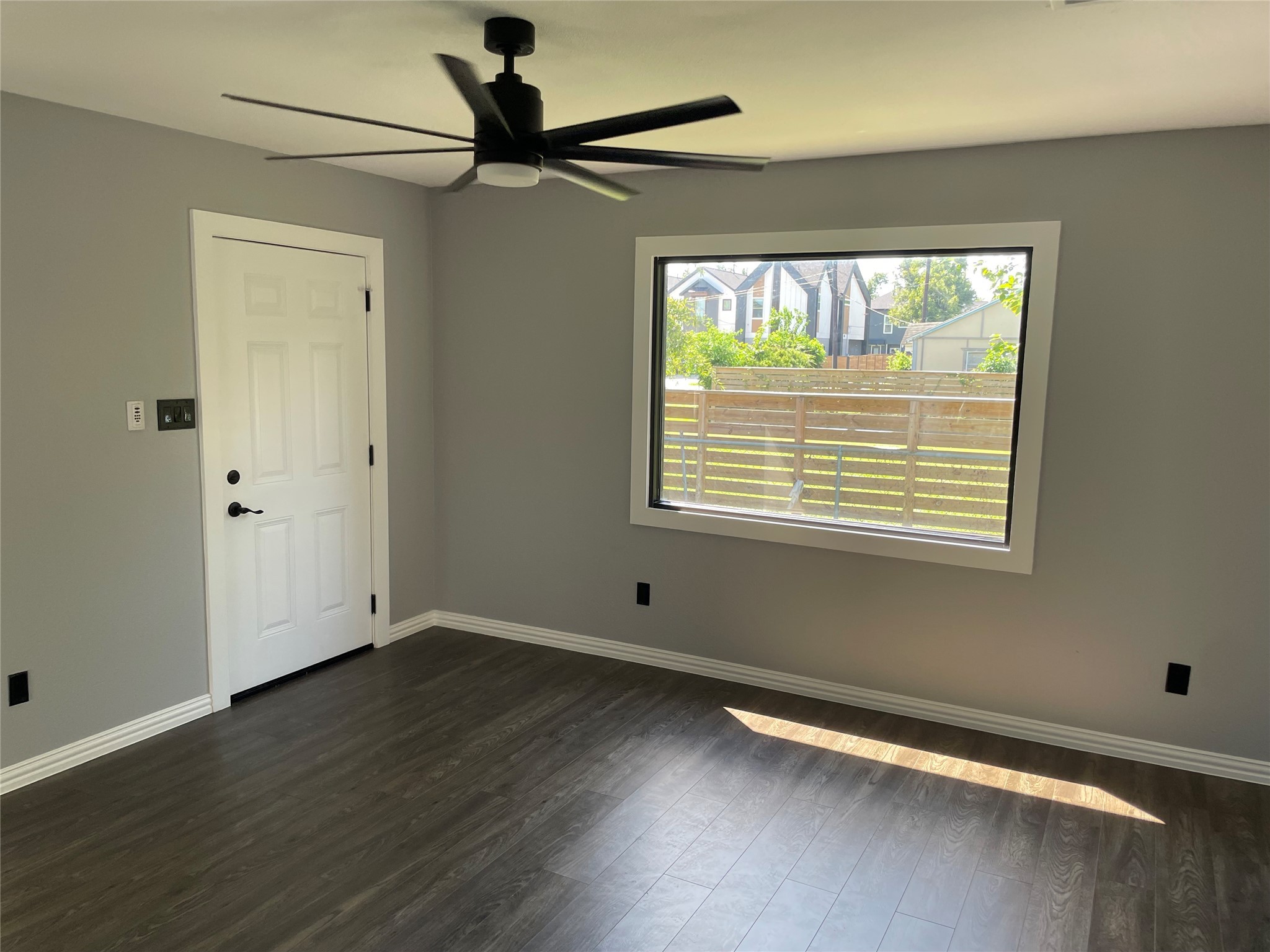 2709 Terry Street Houston, TX 77009 - Photo 6 of 23 a view of an empty room with wooden floor and a window