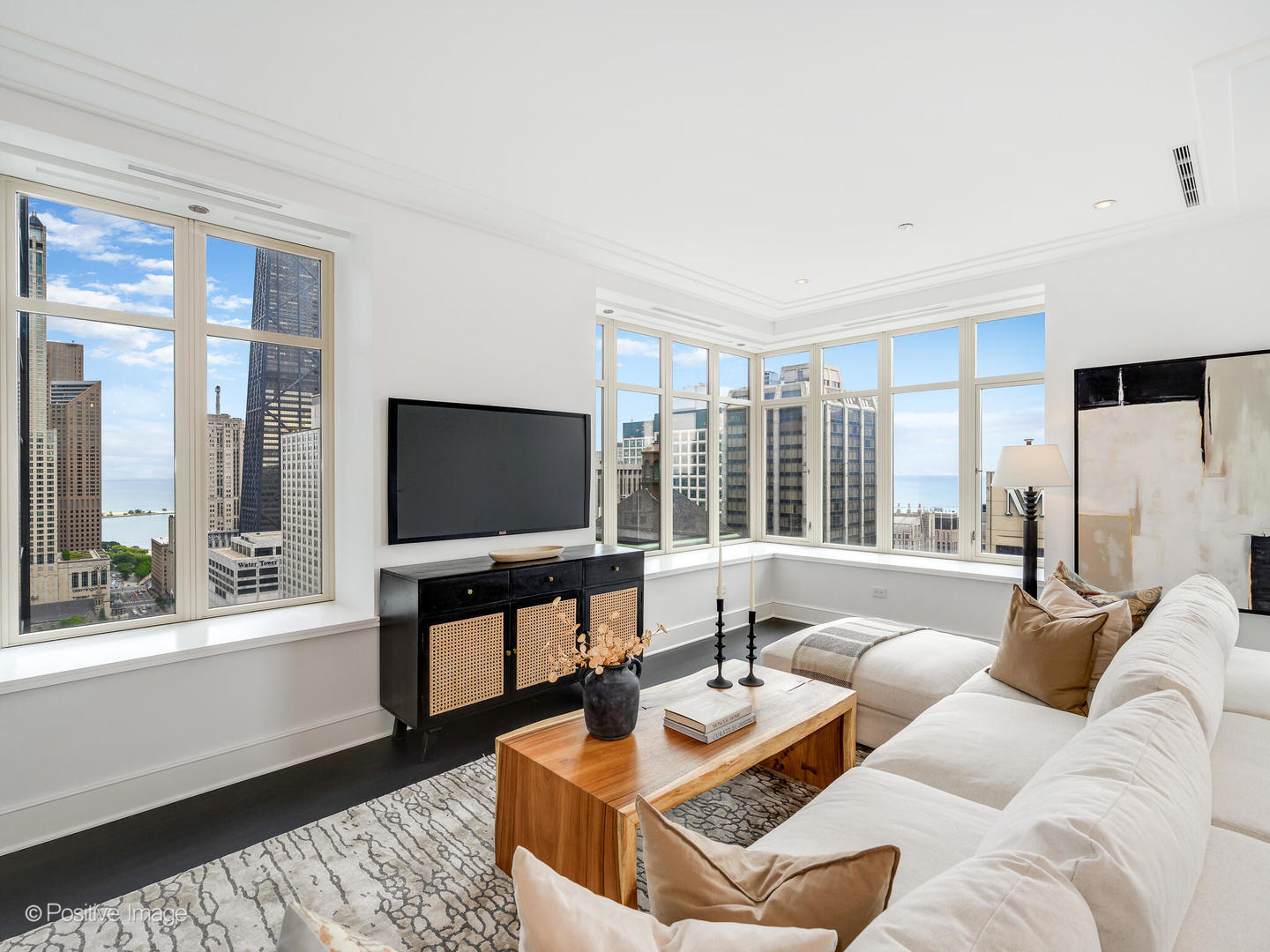 118 East Erie Street, Unit 31G Chicago, IL 60611 - Photo 14 of 54 a living room with furniture and a flat screen tv
