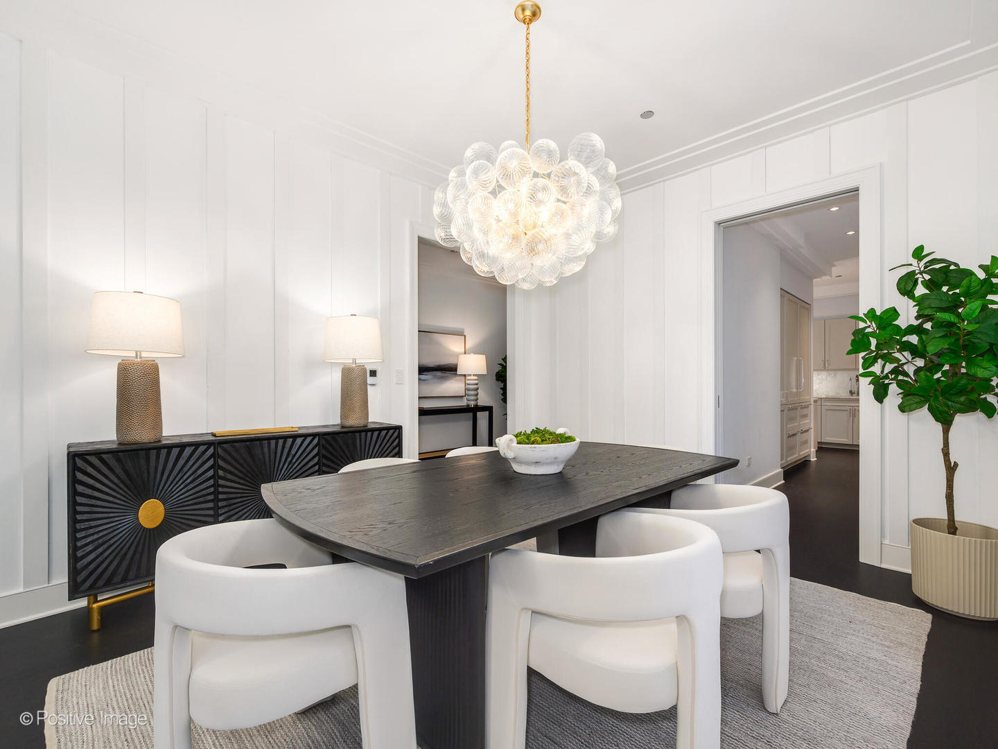 118 East Erie Street, Unit 31G Chicago, IL 60611 - Photo 17 of 54 a view of a dining room with furniture and chandelier