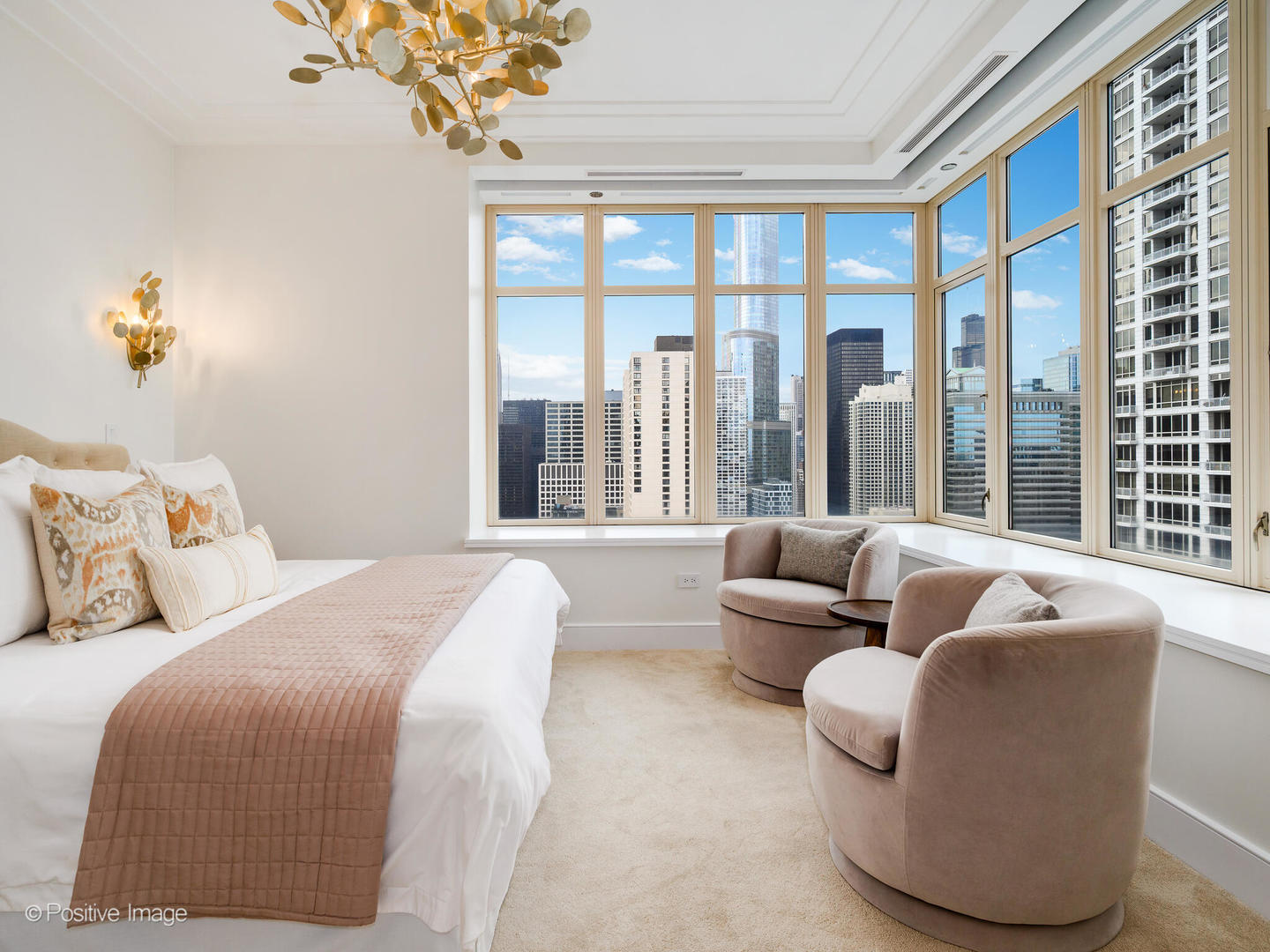 118 East Erie Street, Unit 31G Chicago, IL 60611 - Photo 26 of 54 a bedroom with furniture and large windows