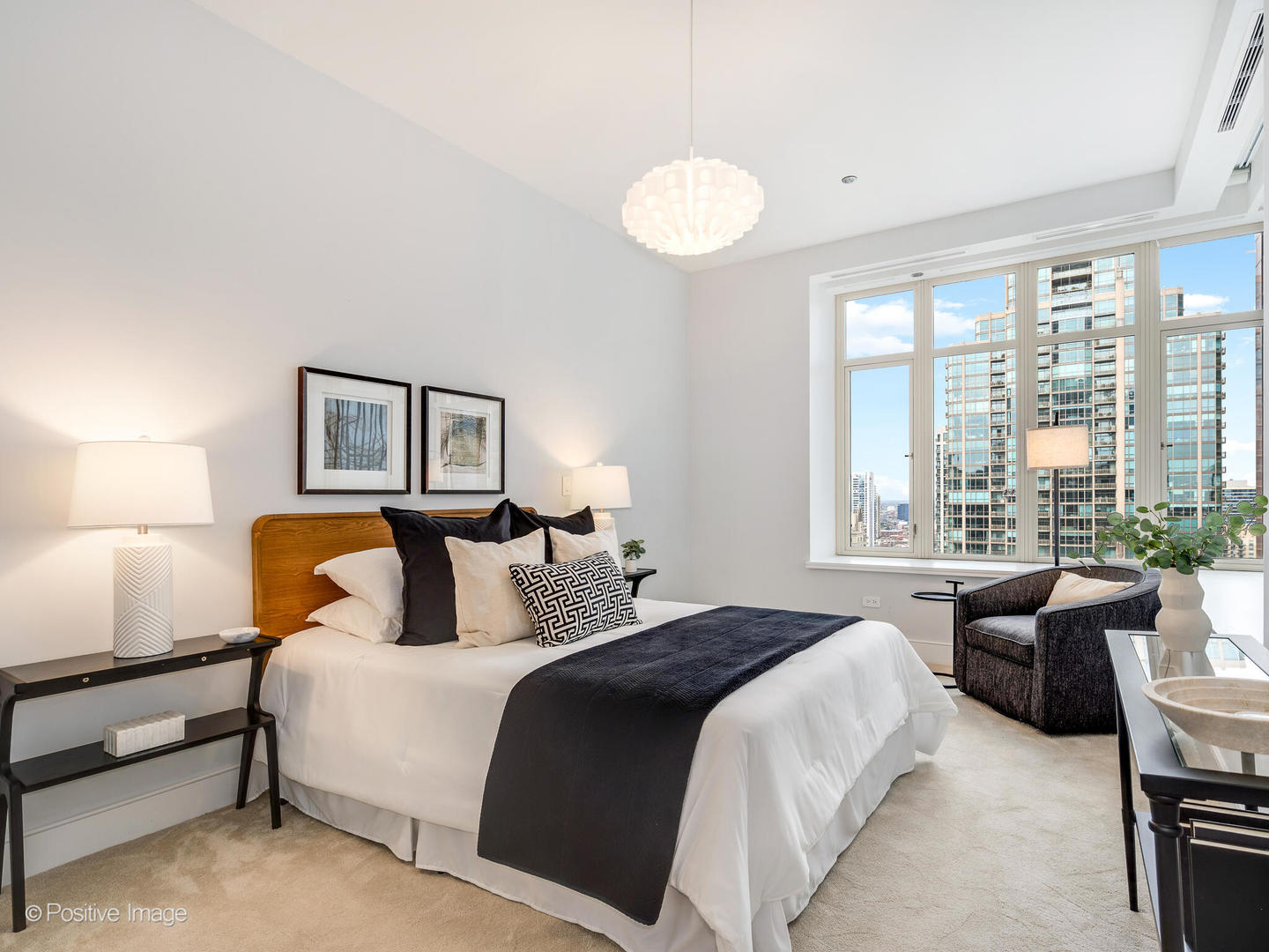 118 East Erie Street, Unit 31G Chicago, IL 60611 - Photo 33 of 54 a bedroom with bed and a large window