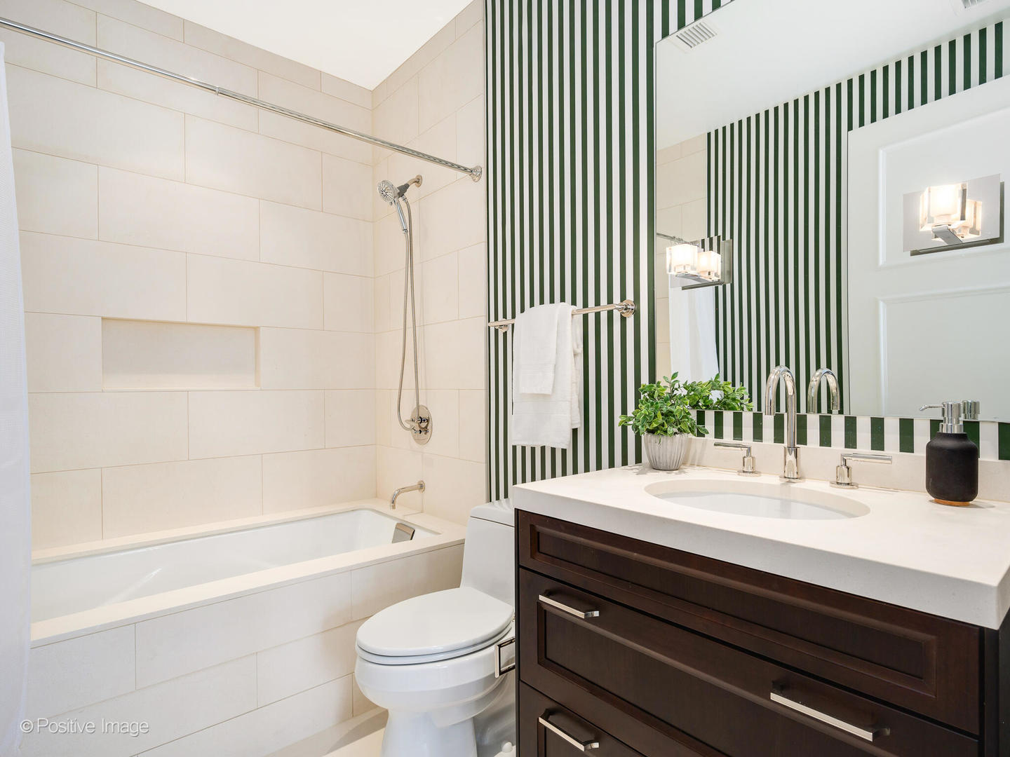 118 East Erie Street, Unit 31G Chicago, IL 60611 - Photo 34 of 54 a bathroom with a bathtub and a toilet