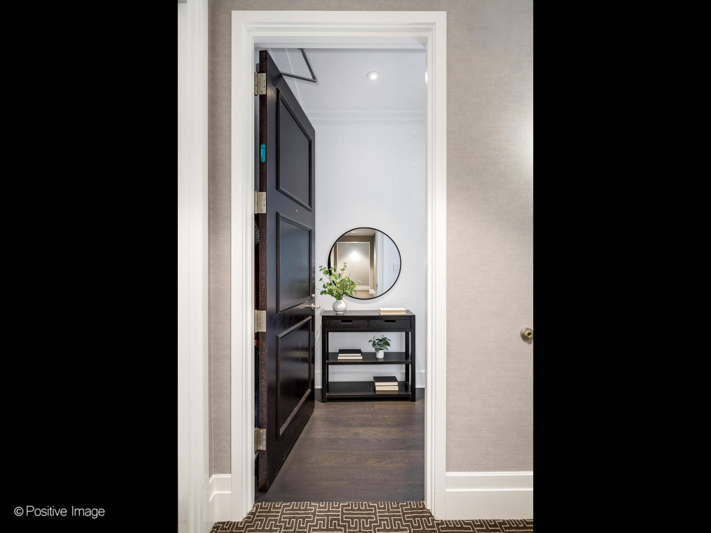 118 East Erie Street, Unit 31G Chicago, IL 60611 - Photo 35 of 54 a view of a hallway to a room and fire pit