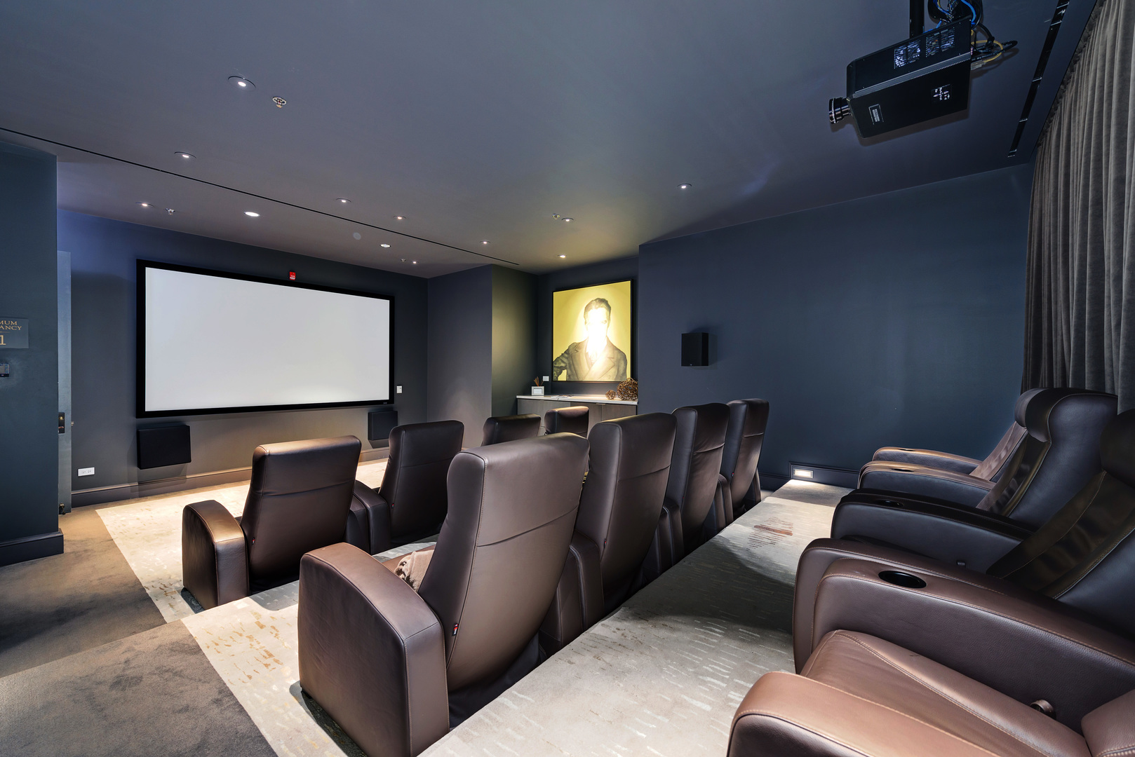 118 East Erie Street, Unit 31G Chicago, IL 60611 - Photo 50 of 54 a projector room with large couches with projector screen