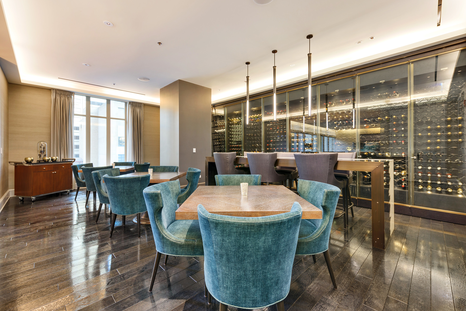 118 East Erie Street, Unit 31G Chicago, IL 60611 - Photo 53 of 54 a dining room with wooden floor glass table and chairs