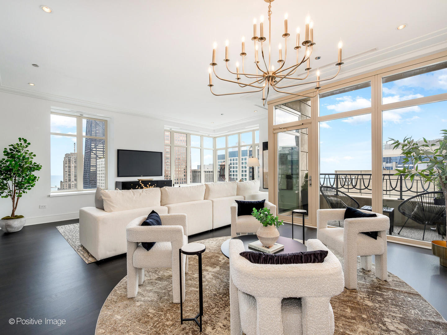 118 East Erie Street, Unit 31G Chicago, IL 60611 - Photo 8 of 54 a living room with furniture a flat screen tv and a large window
