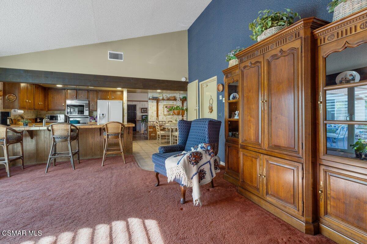 2268 Pinecrest Street Simi Valley, CA 93065 - Photo 11 of 28 a view of a kitchen with dining area a sink and a refrigerator