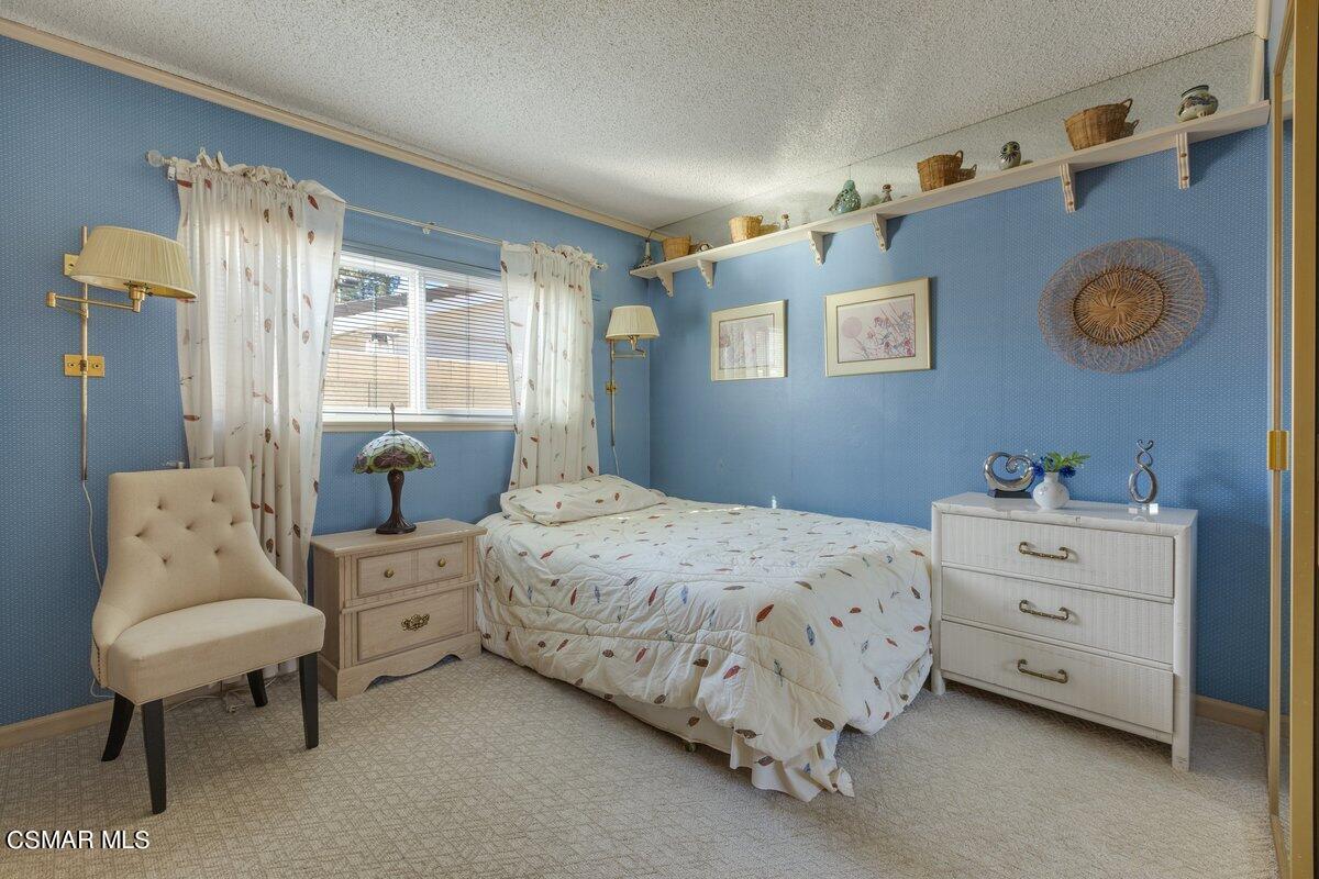 2268 Pinecrest Street Simi Valley, CA 93065 - Photo 14 of 28 a bedroom with a bed and a window