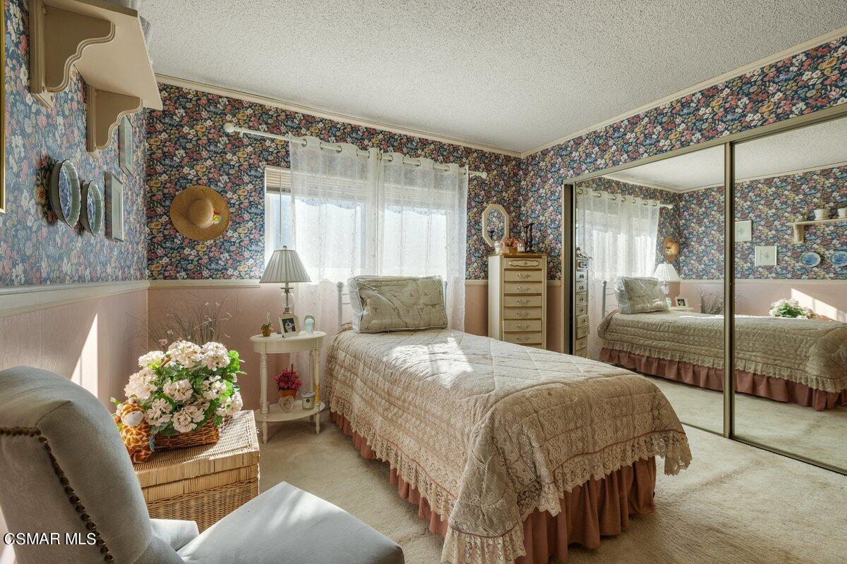 2268 Pinecrest Street Simi Valley, CA 93065 - Photo 18 of 28 a bedroom with a bed and a large mirror