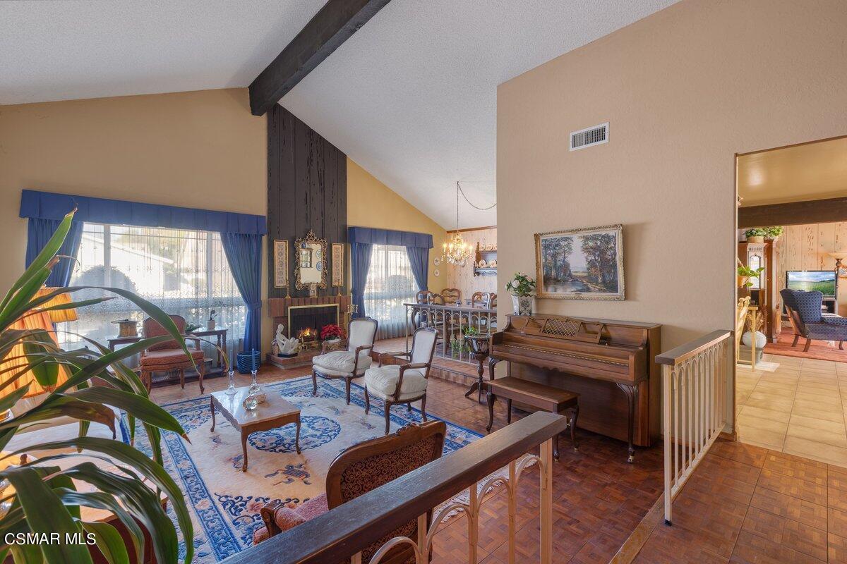2268 Pinecrest Street Simi Valley, CA 93065 - Photo 2 of 28 a living room with furniture and a flat screen tv