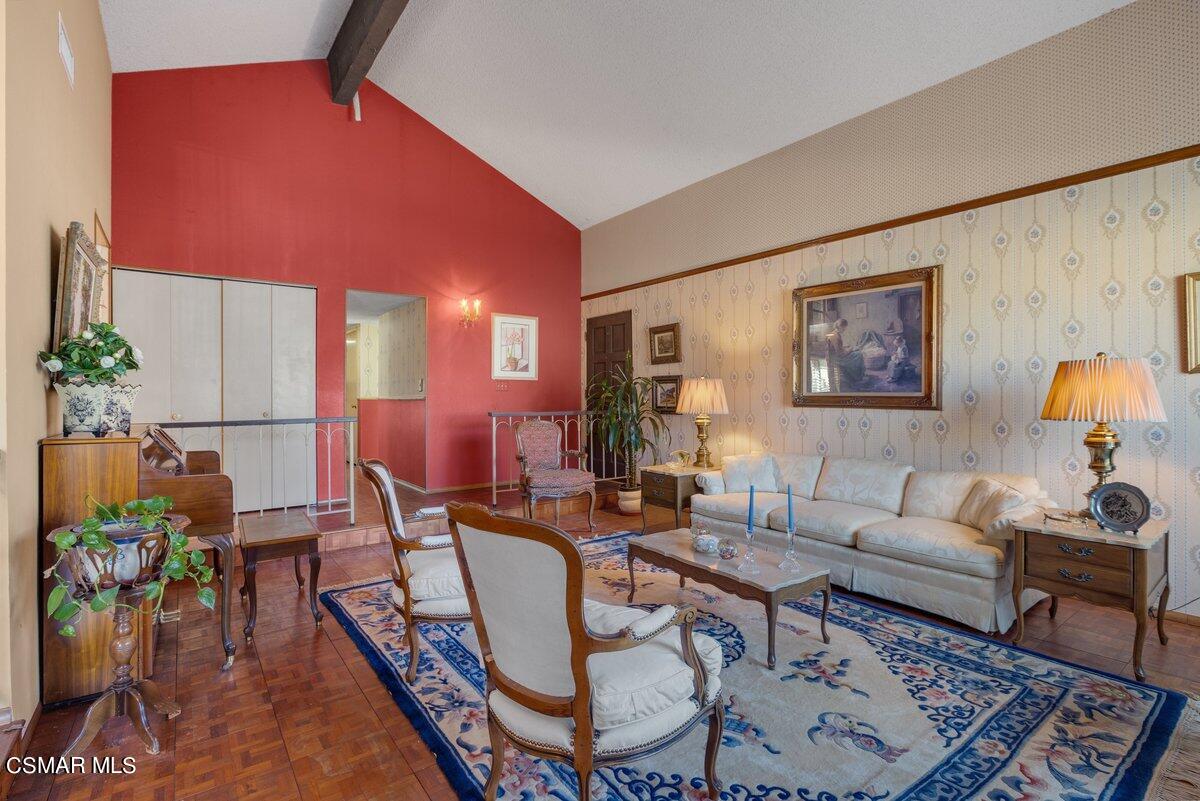 2268 Pinecrest Street Simi Valley, CA 93065 - Photo 4 of 28 a living room with furniture a rug and a painting on the wall