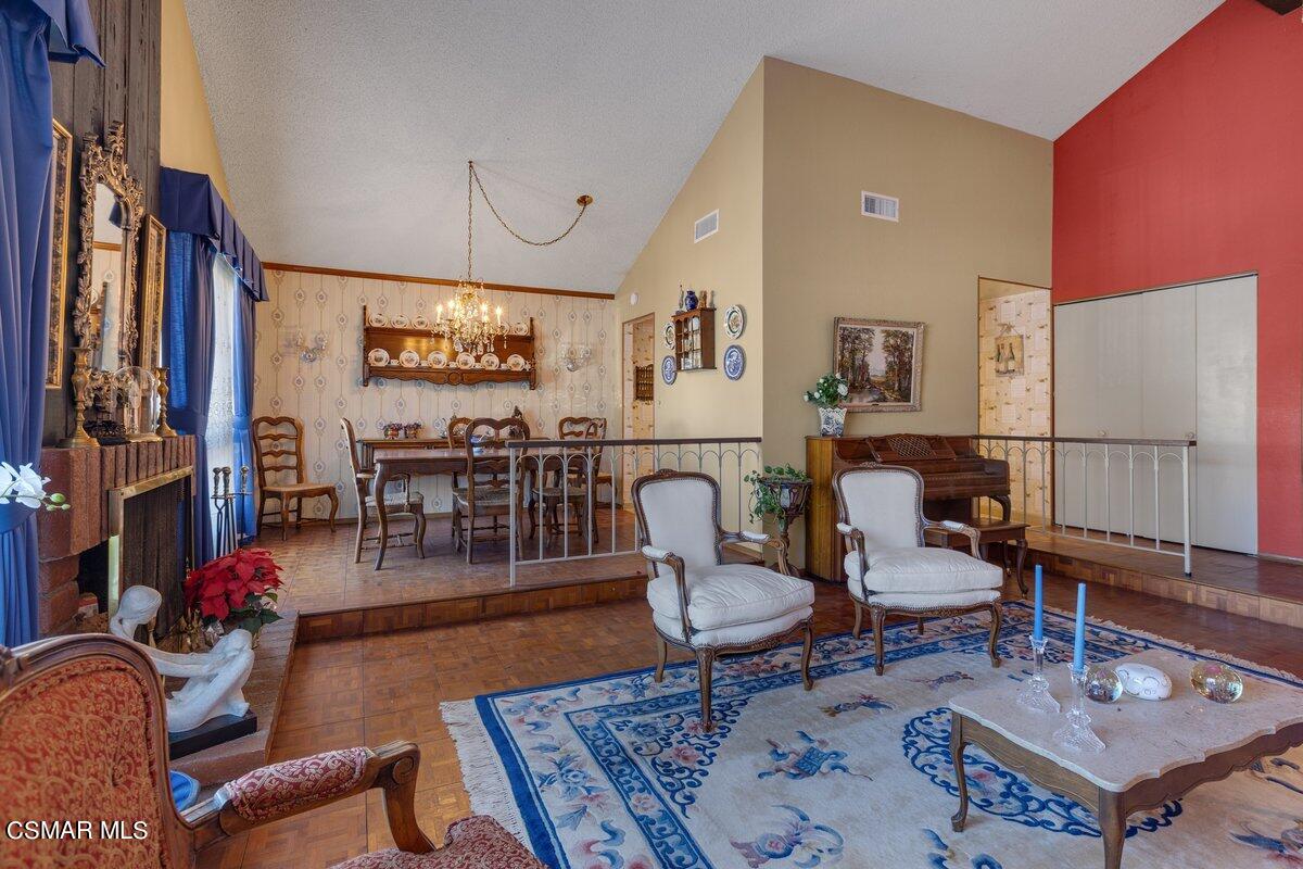 2268 Pinecrest Street Simi Valley, CA 93065 - Photo 5 of 28 a living room with furniture a rug and kitchen view