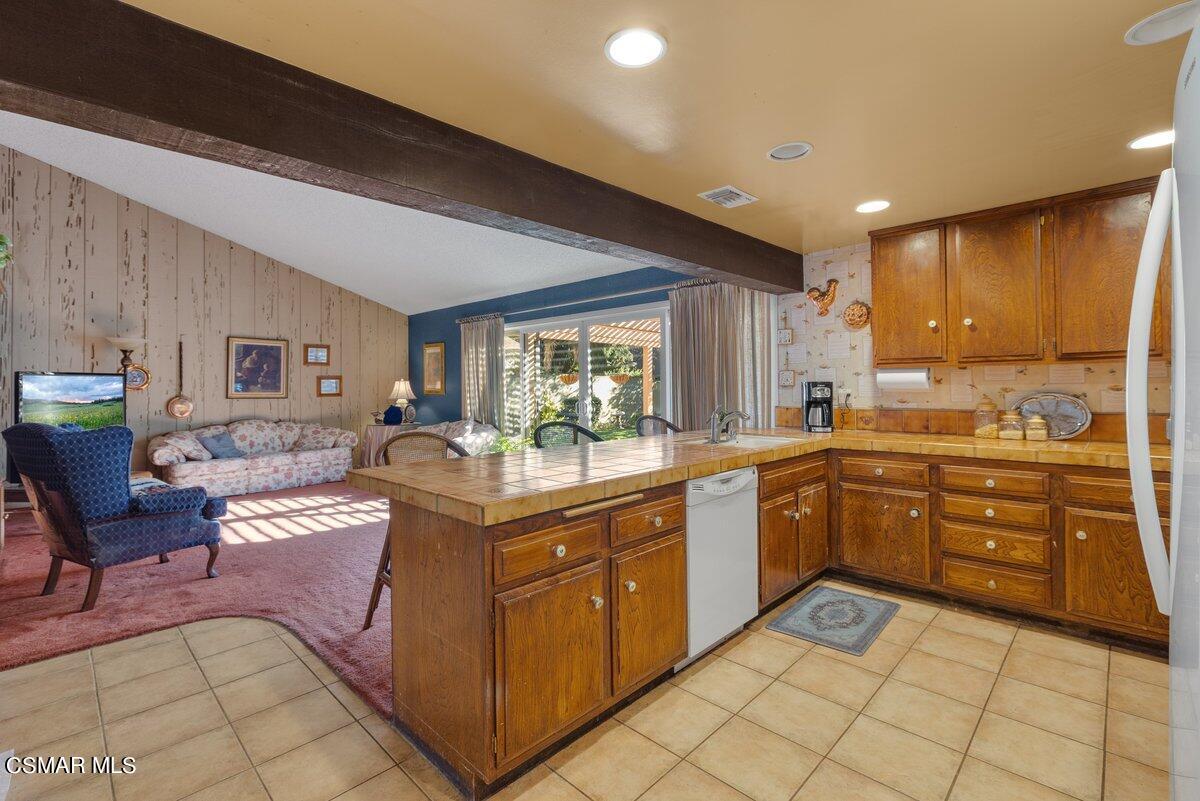 2268 Pinecrest Street Simi Valley, CA 93065 - Photo 10 of 28 a kitchen with stainless steel appliances granite countertop a sink and cabinets