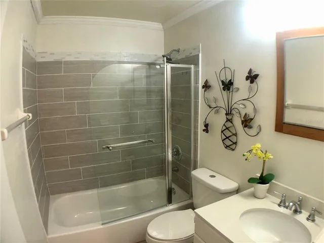 a bathroom with a shower and a sink