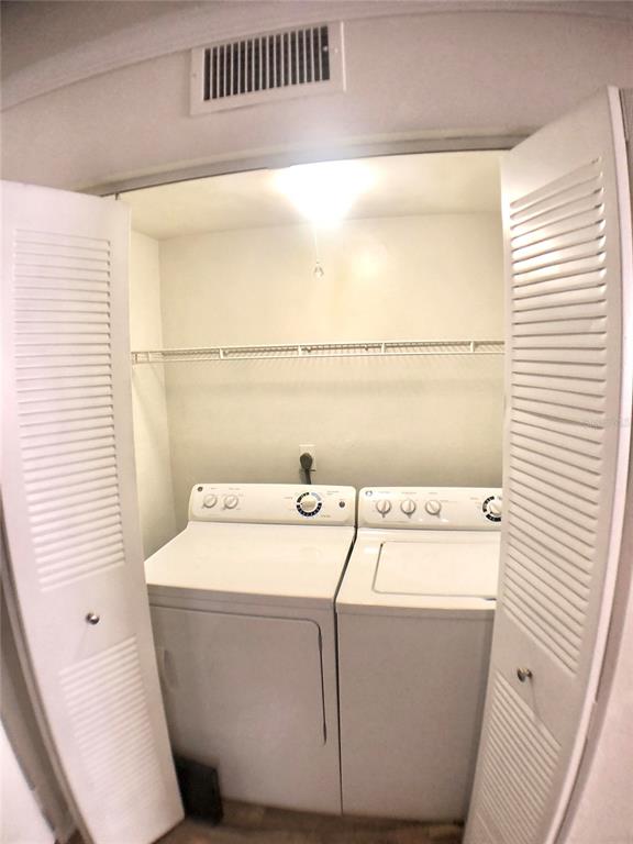 5403 Northwest 20th Court, Unit C Gainesville, FL 32653 - Photo 19 of 21 a utility room with dryer and washer