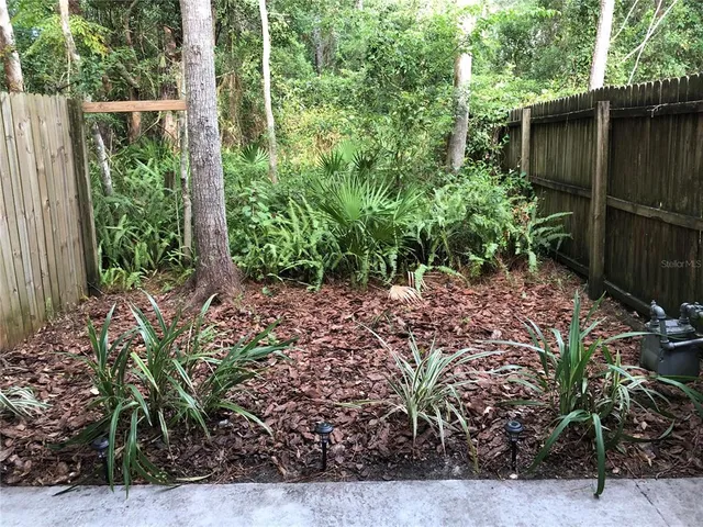 a view of a brick house with many windows