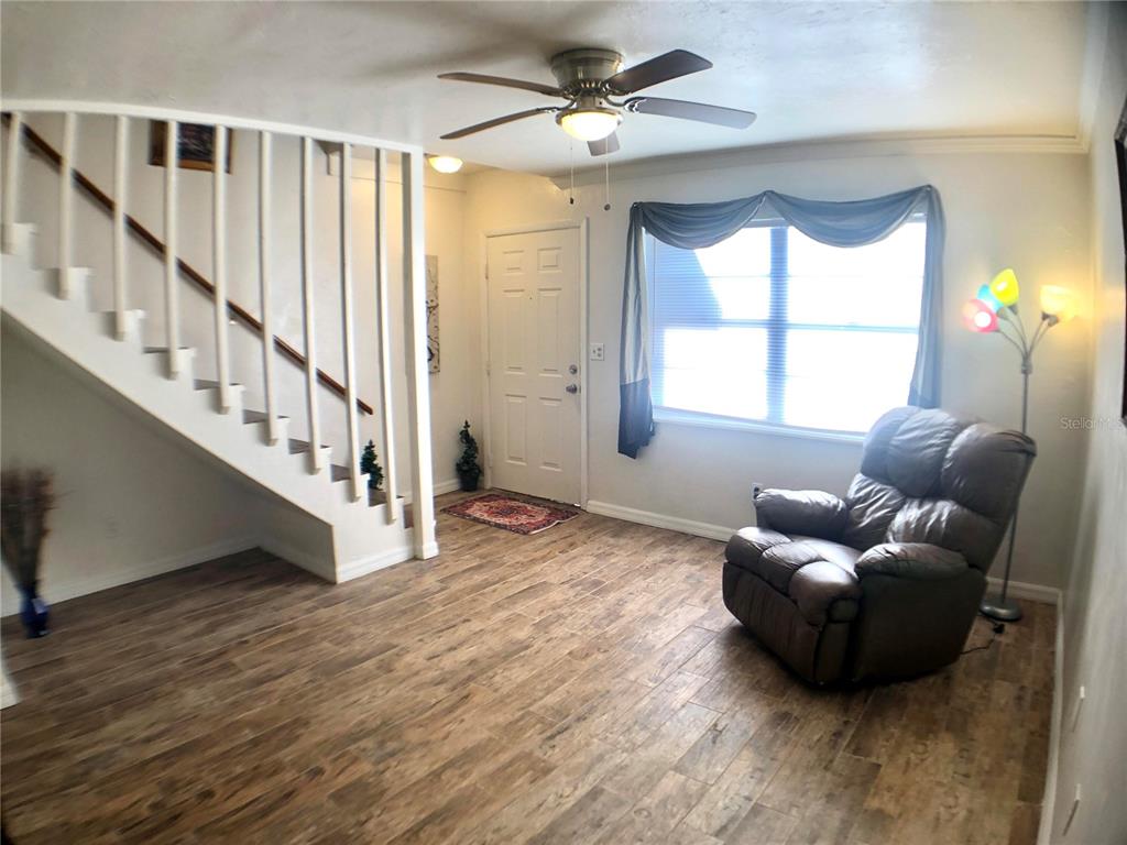 5403 Northwest 20th Court, Unit C Gainesville, FL 32653 - Photo 5 of 21 a living room with furniture and a large window