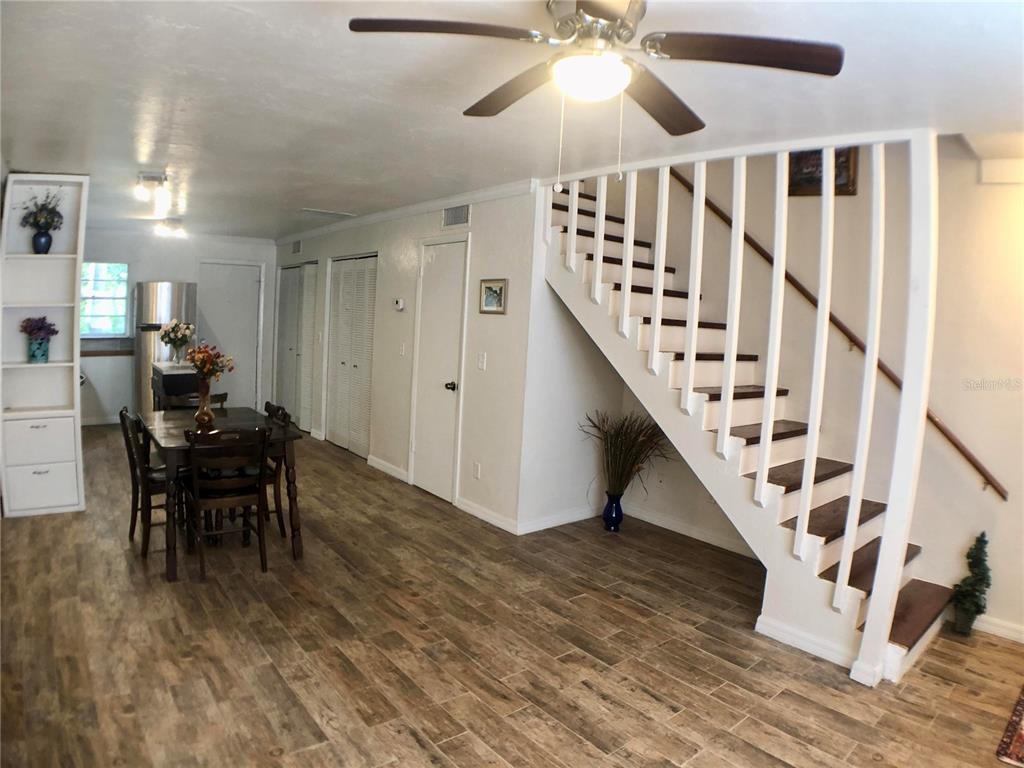 5403 Northwest 20th Court, Unit C Gainesville, FL 32653 - Photo 6 of 21 a view of entryway and hall with wooden floor