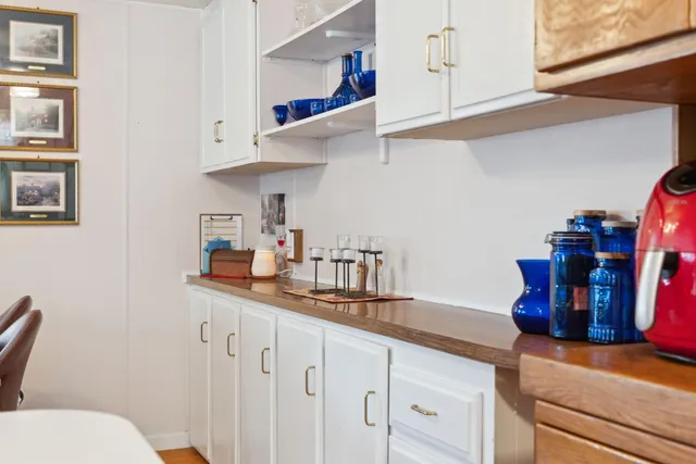 a kitchen with stainless steel appliances a sink and cabinets
