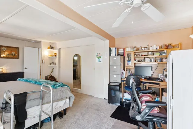 a bedroom with furniture and a bed