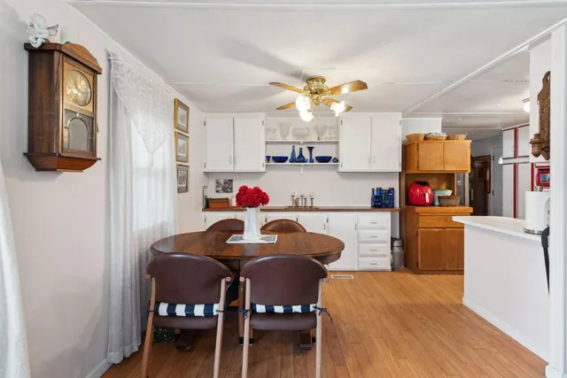 a view of kitchen with cabinets and wooden floor