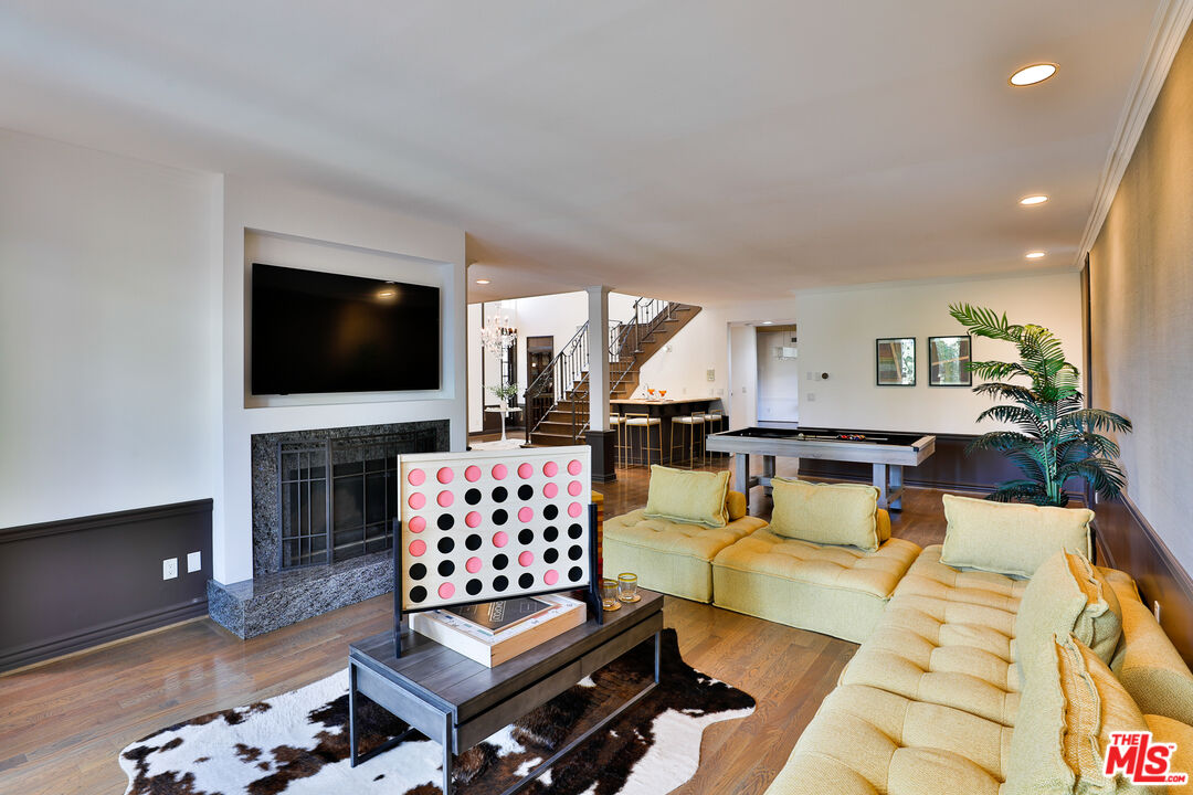 14839 Valley Vista Boulevard Sherman Oaks, CA 91403 - Photo 12 of 65 a living room with furniture fireplace and flat screen tv