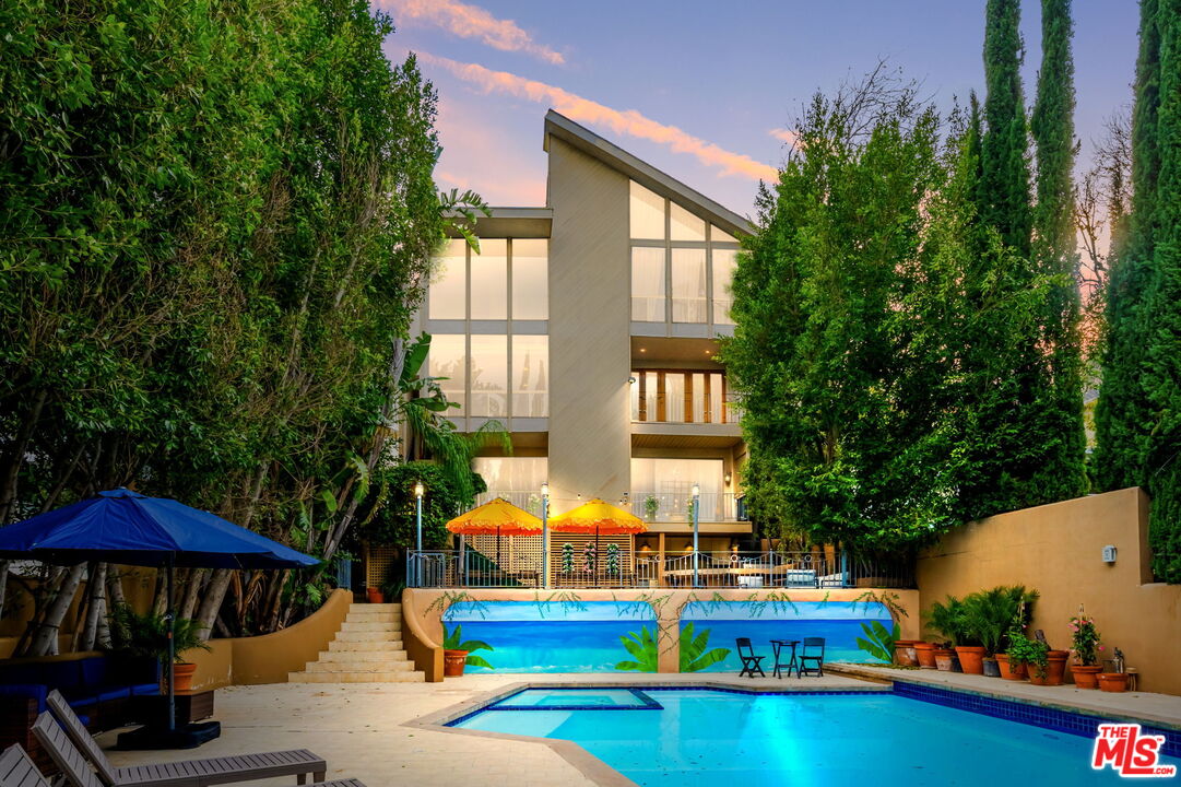 14839 Valley Vista Boulevard Sherman Oaks, CA 91403 - Photo 2 of 65 a view of a swimming pool with a patio