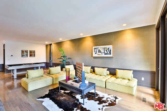 a kitchen with stainless steel appliances granite countertop a sink a stove and a wooden floors