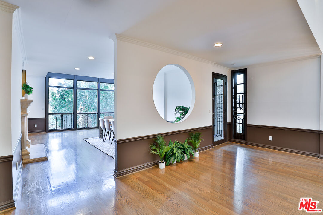 14839 Valley Vista Boulevard Sherman Oaks, CA 91403 - Photo 42 of 65 a living room with furniture and a wooden floor