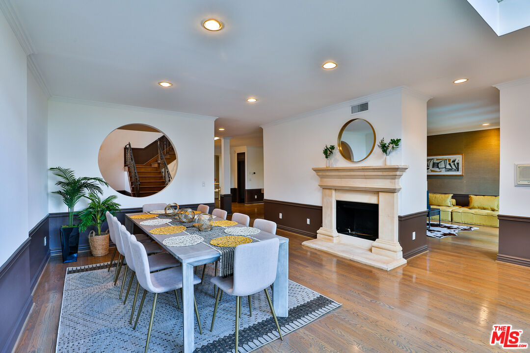 14839 Valley Vista Boulevard Sherman Oaks, CA 91403 - Photo 44 of 65 a living room with furniture a fireplace and a potted plant