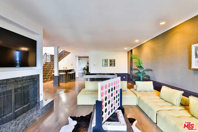 a view of a livingroom with furniture and a fireplace