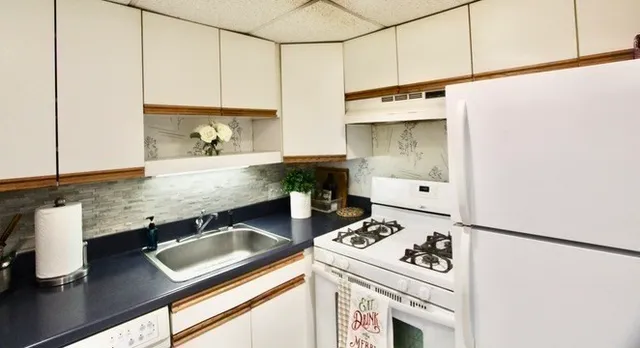 a kitchen with a stove and a sink
