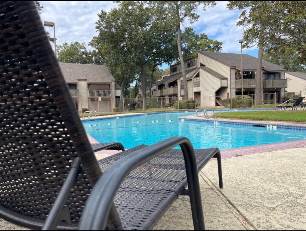 12900 Walden Road, Unit 1010J Montgomery, TX 77356 - Photo 12 of 41 Relaxing at one of two pools at The 18th at Walden.