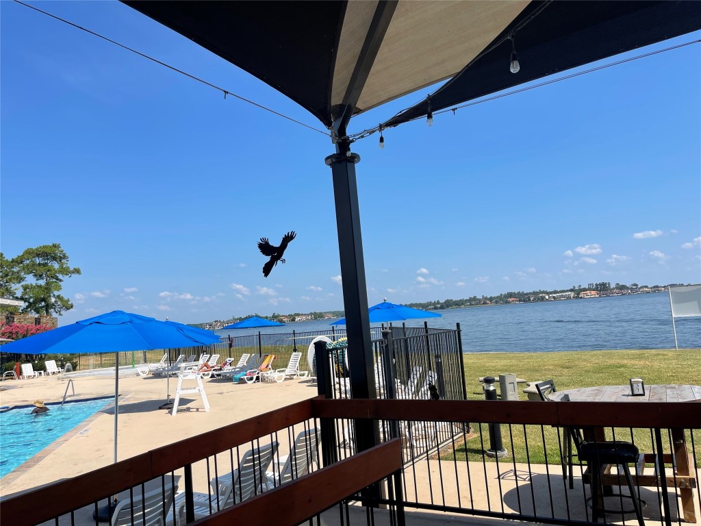 12900 Walden Road, Unit 1010J Montgomery, TX 77356 - Photo 15 of 41 Beautiful view of the Pool at Walden! and Lake Conroe! from Break Water Grill!