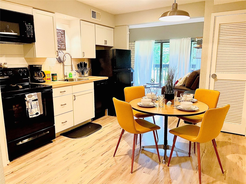 12900 Walden Road, Unit 1010J Montgomery, TX 77356 - Photo 2 of 41 Kitchen and view of Livingroom *Furniture not included