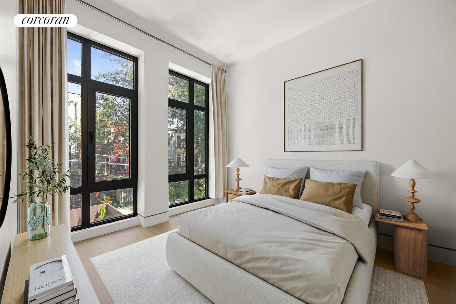 259 Halsey Street, Unit 3R Brooklyn, NY 11216 - Photo 5 of 10 a bedroom with a large bed and a large window