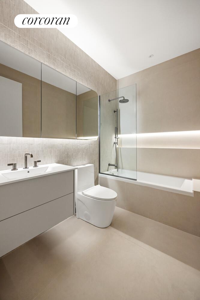 259 Halsey Street, Unit 3R Brooklyn, NY 11216 - Photo 8 of 10 a bathroom with a sink a toilet and shower